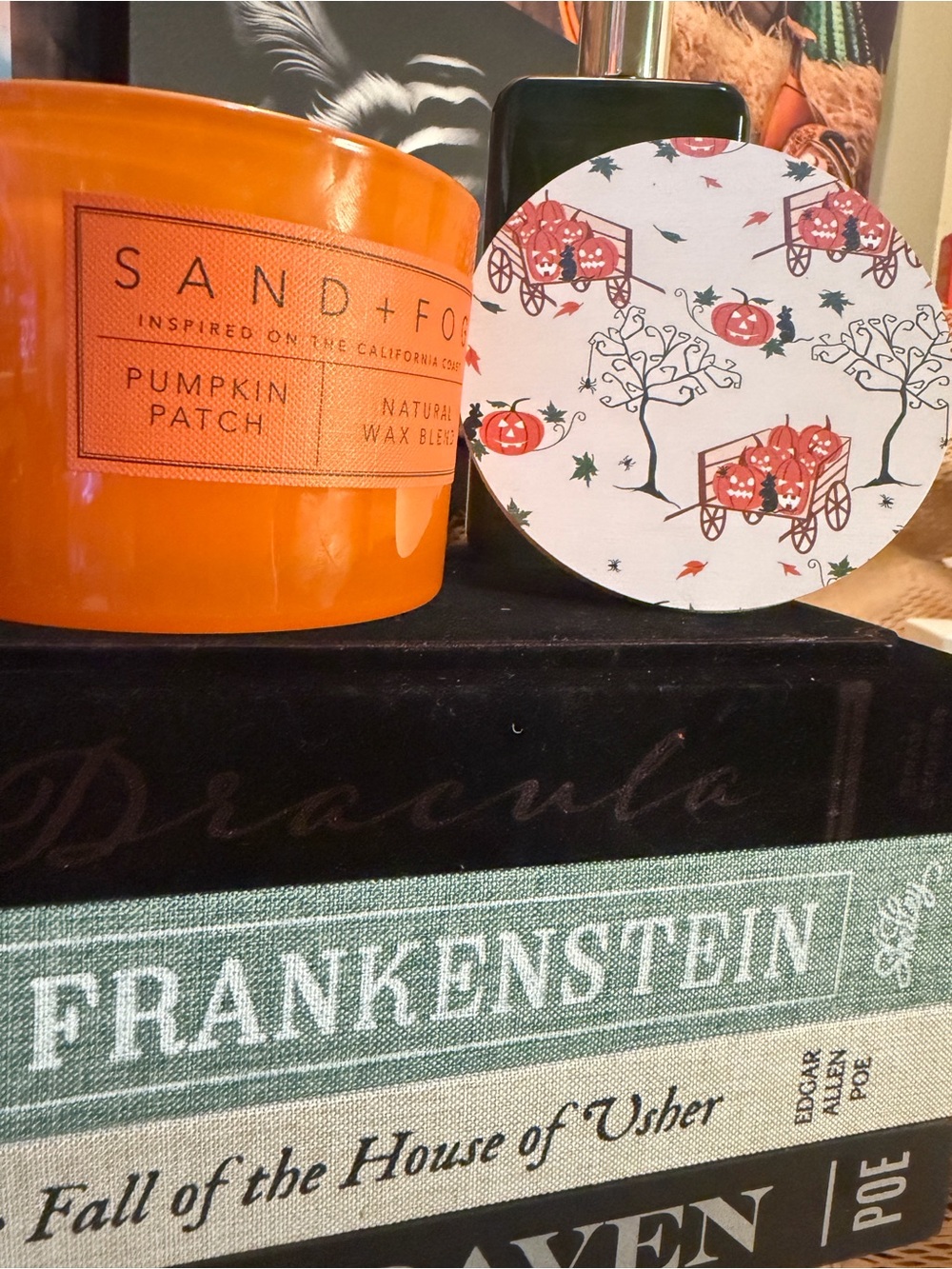 SAND+FOG 2 wick Pumpkin Patch Scented Candle with Spooky Pumpkin cart lid.
